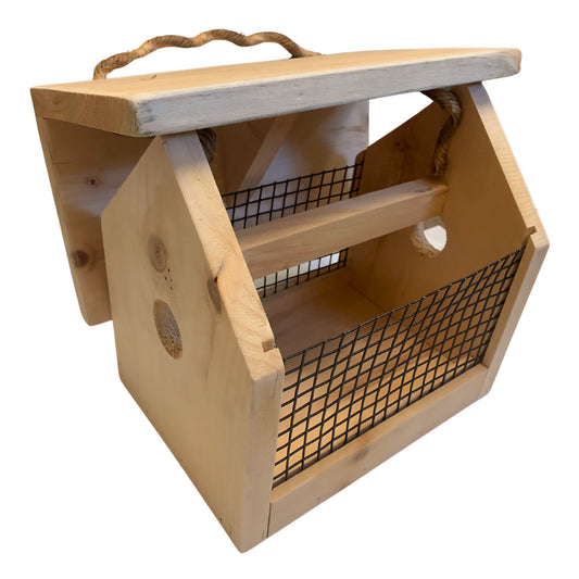 A wooden bird feeder that has coated metal wire on the sides two entrance holes and a slanted roof
with the aspen song packaging